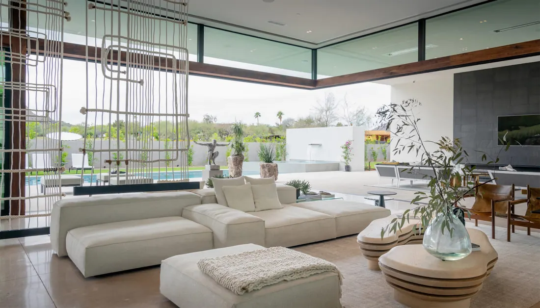 Modern living room with a wall-mounted display and distributed audio