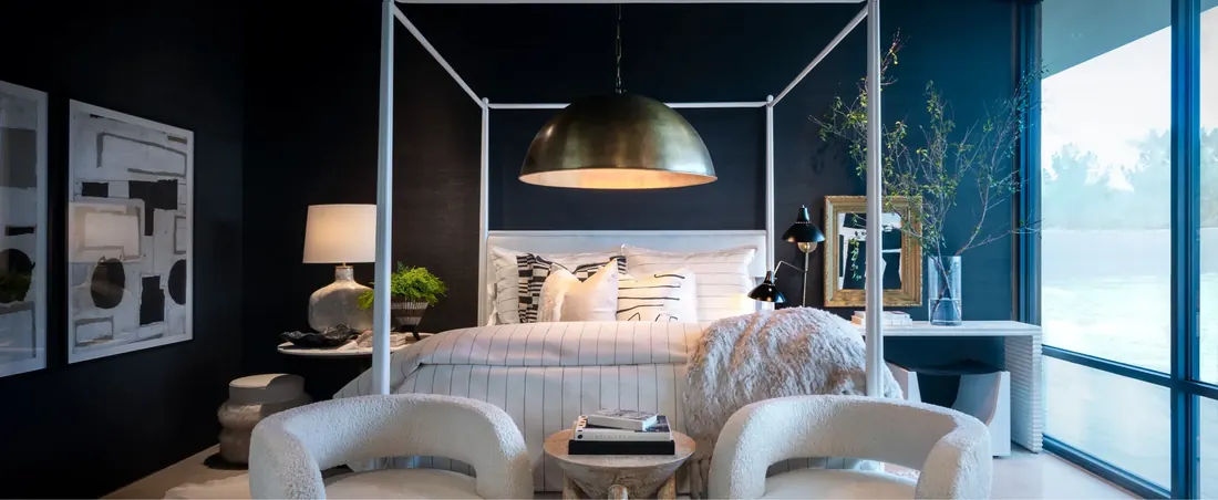 Bedroom with motorized shades and a Crestron keypad