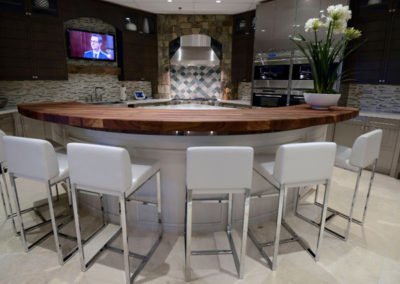 Basement bar with lighting and media controls.